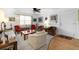 Living room featuring neutral carpet, a ceiling fan, and lots of furniture and natural light at 8174 Terrace Garden N Dr # 204, St Petersburg, FL 33709