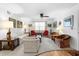 Cozy living room with carpet, ceiling fan, and lots of furniture, decor, and natural light at 8174 Terrace Garden N Dr # 204, St Petersburg, FL 33709