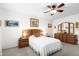 Comfortable bedroom with neutral carpet and ceiling fan at 8174 Terrace Garden N Dr # 204, St Petersburg, FL 33709