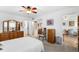 Spacious bedroom with dresser, closet and view to a dining room area at 8174 Terrace Garden N Dr # 204, St Petersburg, FL 33709