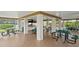 Community picnic area with green tables and grill at 8174 Terrace Garden N Dr # 204, St Petersburg, FL 33709