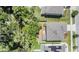 Aerial view of the home and backyard, showing backyard layout and neighborhood at 8208 Praise Dr, Tampa, FL 33625
