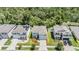 Aerial view of a home in a neatly planned neighborhood with tree-lined streets at 8208 Praise Dr, Tampa, FL 33625