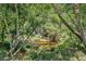 Picturesque view of a peaceful creek nestled among trees, enhancing the natural beauty of the backyard at 8208 Praise Dr, Tampa, FL 33625