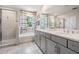 Bathroom featuring a separate tub and shower with double sinks and white tile at 8208 Praise Dr, Tampa, FL 33625