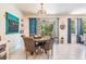 Dining area with round table for four with sliding glass doors and natural light at 8208 Praise Dr, Tampa, FL 33625