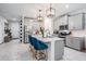 Spacious kitchen with gray cabinetry, a center island, and modern appliances at 8208 Praise Dr, Tampa, FL 33625
