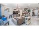 Living room featuring cozy seating and white tile floors at 8208 Praise Dr, Tampa, FL 33625