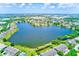Lovely aerial showcasing the lake and residences in this waterfront community at 8253 118Th Ave, Largo, FL 33773