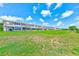 Building exterior featuring backyard patio and well maintained lawn at 8253 118Th Ave, Largo, FL 33773