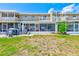 Building exterior featuring backyard patio and well maintained lawn at 8253 118Th Ave, Largo, FL 33773
