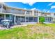 Building exterior featuring backyard patio and well maintained lawn at 8253 118Th Ave, Largo, FL 33773