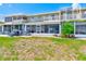 Building exterior featuring backyard patio and well maintained lawn at 8253 118Th Ave, Largo, FL 33773