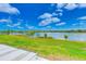 Gorgeous lake view with clear blue sky and lush green landscape at 8253 118Th Ave, Largo, FL 33773