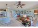Inviting open concept living room showcasing seamless flow to the kitchen and staircase at 8253 118Th Ave, Largo, FL 33773