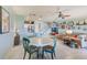 Open concept living area with dining table leading to the kitchen and living room at 8253 118Th Ave, Largo, FL 33773