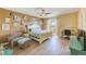 Comfortable bedroom with chair, desk, and sliding glass door to the outdoor balcony at 8253 118Th Ave, Largo, FL 33773