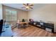 Spacious office with wood flooring, ample shelving, and a window that lets in natural light at 8253 118Th Ave, Largo, FL 33773