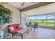Relaxing sunroom with comfortable seating and stunning lake views at 8253 118Th Ave, Largo, FL 33773