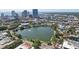 Scenic aerial view of downtown featuring a tranquil lake surrounded by lush green trees and modern buildings at 841 4Th N Ave # 55, St Petersburg, FL 33701