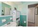 Bathroom featuring a vanity sink, mirror, and ceramic tiles at 841 4Th N Ave # 55, St Petersburg, FL 33701