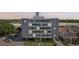 Multi-story Suncoast Towers building featuring a gray exterior, ample windows, and covered parking at 841 4Th N Ave # 55, St Petersburg, FL 33701