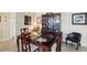 Elegant dining space showcasing a dark wood table, upholstered chairs, and a decorative display cabinet, great for formal occasions at 841 4Th N Ave # 55, St Petersburg, FL 33701