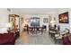 Bright dining room featuring a wooden table, upholstered chairs, and stylish decor, creating an inviting space for meals at 841 4Th N Ave # 55, St Petersburg, FL 33701
