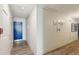 Hallway with wood-look flooring, neutral walls, and apartment entry door at 841 4Th N Ave # 55, St Petersburg, FL 33701