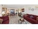 Spacious living area with a combination of traditional and modern elements, including a comfortable sofa and elegant dining setup at 841 4Th N Ave # 55, St Petersburg, FL 33701