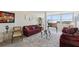 Inviting living room with a plush sofa, glass coffee table, and scenic views through the large windows, offering comfort and style at 841 4Th N Ave # 55, St Petersburg, FL 33701
