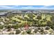 Community aerial view showing single Gathering home, golf course, and landscaping at 8433 101St Ave, Seminole, FL 33777
