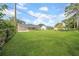 Expansive backyard features lush lawn and covered patio at 8433 101St Ave, Seminole, FL 33777