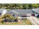 Charming single-story home features neutral paint, dark roof, and verdant landscaping at 8433 101St Ave, Seminole, FL 33777