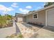 A single-story home with a paved walkway leading to the front door and attached garage at 8433 101St Ave, Seminole, FL 33777