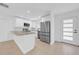 Recently remodeled kitchen with white cabinets and stainless steel appliances at 8433 101St Ave, Seminole, FL 33777