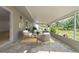 Cozy covered patio with tiled flooring, perfect for outdoor relaxation and entertaining at 8433 101St Ave, Seminole, FL 33777