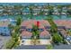 Aerial view of a multi-Gathering home with red tile roof and boat docks on the canal at 903 Pinellas Bayway S # 103, Tierra Verde, FL 33715