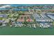 A waterfront property with a community of townhomes, boat docks, and open views of the water at 903 Pinellas Bayway S # 103, Tierra Verde, FL 33715
