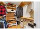 Walk-in closet featuring built-in shelving and hanging storage at 903 Pinellas Bayway S # 103, Tierra Verde, FL 33715