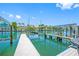 Beautiful waterfront dock with boat lift and canal views at 903 Pinellas Bayway S # 103, Tierra Verde, FL 33715