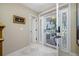Foyer featuring glass-accented front door and marble floors at 903 Pinellas Bayway S # 103, Tierra Verde, FL 33715