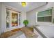 Inviting front porch featuring tile flooring and decorative glass windows at 903 Pinellas Bayway S # 103, Tierra Verde, FL 33715