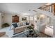 Cozy living room features elegant decor, plush seating, and view to dining area at 903 Pinellas Bayway S # 103, Tierra Verde, FL 33715