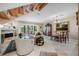 Cozy living room with a fireplace, elegant decor, and access to an outdoor patio at 903 Pinellas Bayway S # 103, Tierra Verde, FL 33715
