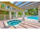 Inviting jacuzzi and pool area features a relaxing space for outdoor enjoyment and entertaining at 903 Pinellas Bayway S # 103, Tierra Verde, FL 33715