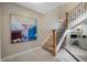 Elegant staircase with wood treads and iron railing, marble floors and artwork at 903 Pinellas Bayway S # 103, Tierra Verde, FL 33715