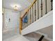 Staircase features marble floors, detailed iron spindles and wood handrail at 903 Pinellas Bayway S # 103, Tierra Verde, FL 33715