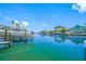 Beautiful waterfront property featuring a dock and boat lift at 903 Pinellas Bayway S # 103, Tierra Verde, FL 33715