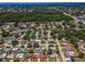 A serene aerial view of a neighborhood showcasing the property's location and tree-lined streets at 9952 111Th St, Seminole, FL 33772